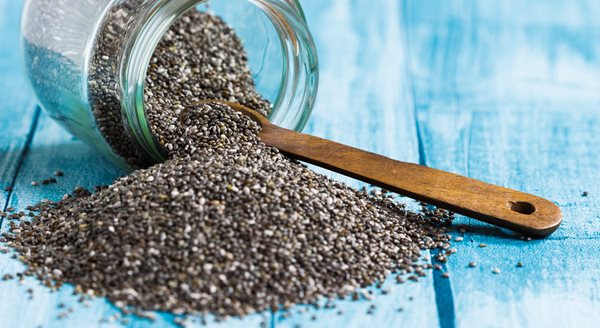 Chia-seeds-with-wooden-spoon-on-blue-background-selective-focus_shutterstock_259110158.jpg